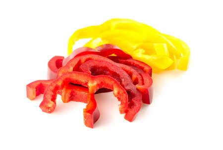 Juicy strips of red and yellow peppers isolated on whiteの写真素材