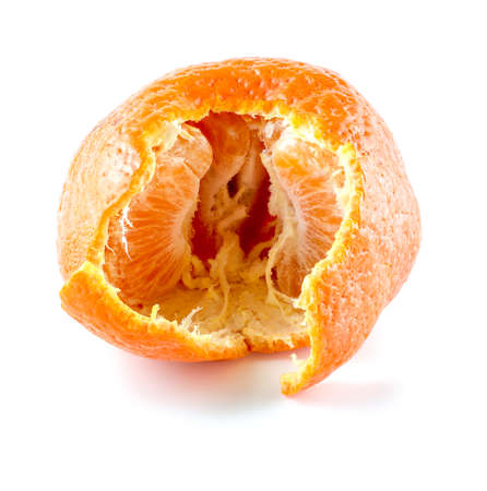 Torn mandarin showing inside with segments of citrusの写真素材