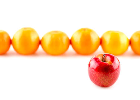 Red apple infront of oranges, odd one outの写真素材