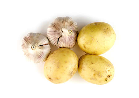 Aerial view of whole onions and onion heads isolated on whiteの写真素材