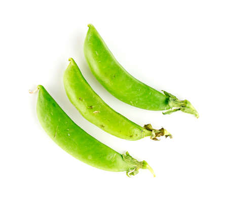 Three pods of sugar snap legumes on whiteの写真素材