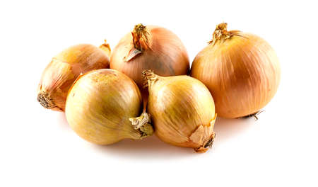 Group of bright orange onions on whiteの写真素材