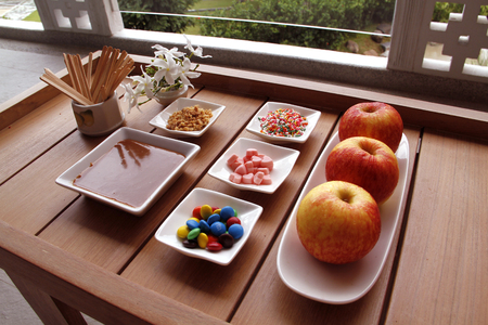 Sweet caramel apples and Topping candyの写真素材