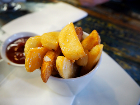Traditional French potato fries with tomato ketchup