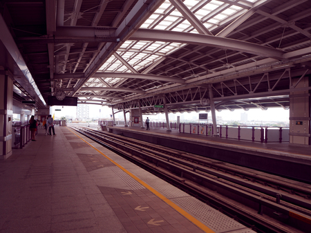 People waiting for BTS train at the station, Bangkokのeditorial素材