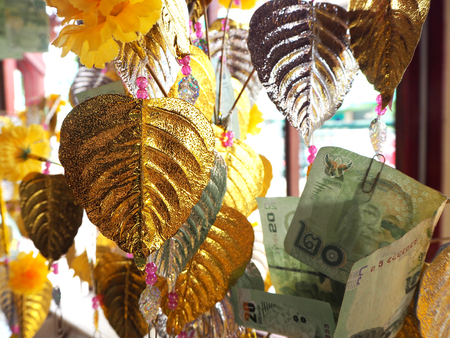 golden Pho leaf, the traditional Thaiの写真素材