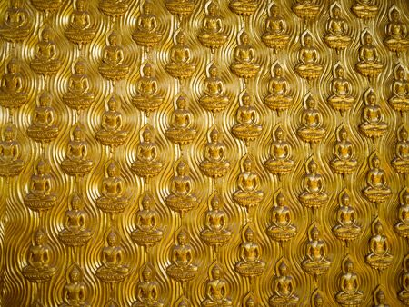 Golden buddha on wall background, in Ancient Cityの写真素材