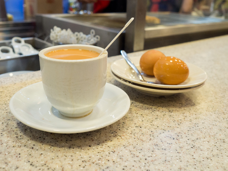 Singapore Breakfast called Kaya Toast, Coffee bread and Half boiled eggs.の写真素材