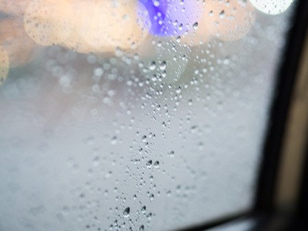 Rain drop on the car glass background, the heavy rainy.の写真素材