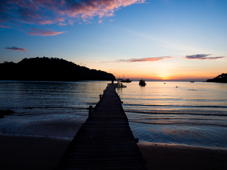 Wood bridge on the sea with a beautiful sunset at koh kood island, Thailandの写真素材