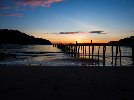 Wood bridge on the sea with a beautiful sunset at koh kood island, Thailandの写真素材