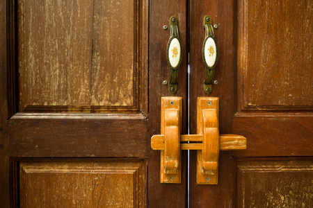 Lock on the door of an wooden house.の写真素材