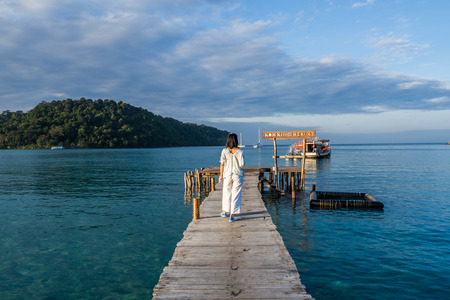woman is relaxing on wood bridge in beautiful island, koh kood island, Trat Thailand, Nov 2018