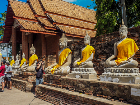 Ancient statues of meditating buddha sitting, at Wat Yai Chaimongkol in Ayutthaya, Thailand, Feb 2019のeditorial素材
