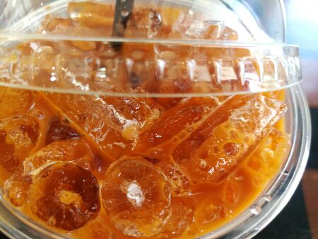 Thai milk tea sweet Cold drink on a tableの写真素材