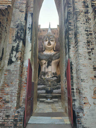 Buddha Statue at Wat Mahathat temple, Wat Si Chum Historical Park in Sukhothai, Thailand. the UNESCO world heritageの写真素材