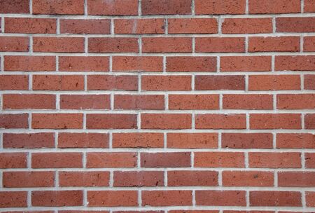 Background lined with red colored bricksの写真素材