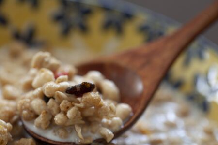 Milk poured cereal and dried fruitsの写真素材