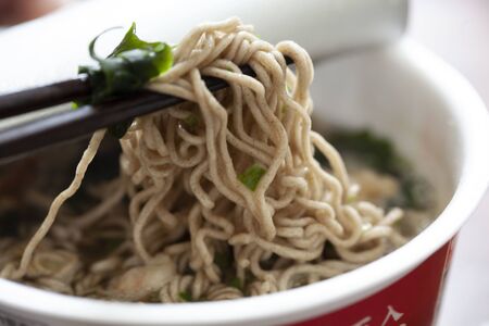 Cook instant Japanese soba in a cupの写真素材
