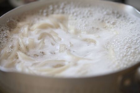 Cooking udon with Japanese foodの写真素材
