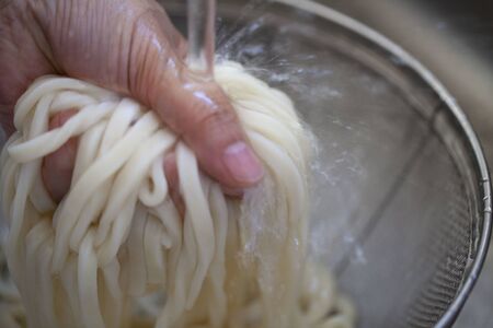 Cooking udon with Japanese foodの写真素材