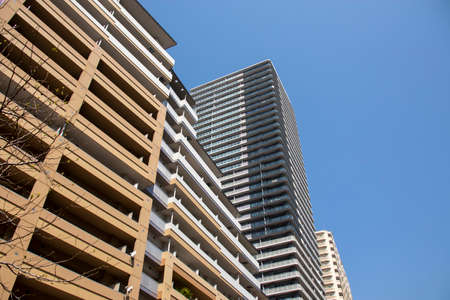 Japanese skyscrapers and blue sky looking up/ April 4, 2020 Osaka City, Osaka Prefecture, Japanのeditorial素材
