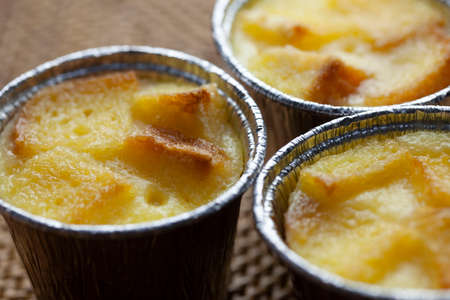 Bread pudding in a silver cupの写真素材