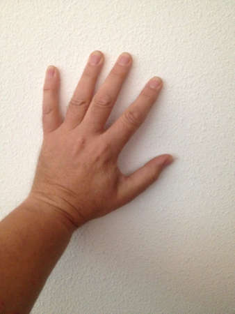 Left hand against wallの素材