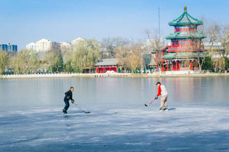 Men are playing ice hockey on the iceのeditorial素材