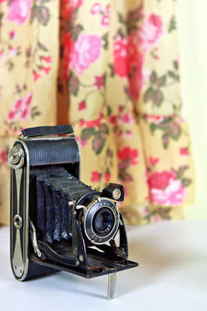 Vintage film camera on a dress backgroundの写真素材