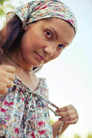 Portrait of a girl in retro dress on natureの写真素材