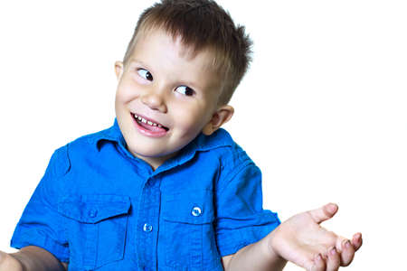 Funny gesticulating 3-year-old boy in a blue shirt on a white background