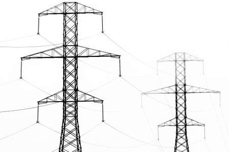 High key black and white abstract of power line towers and fog.の写真素材