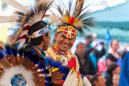 Portland, Oregon, USA - June, 14, 2014: Native Americans dressed in full regalia laughing and having fun at Delta Park annual Pow Wow in Portland Oregonのeditorial素材