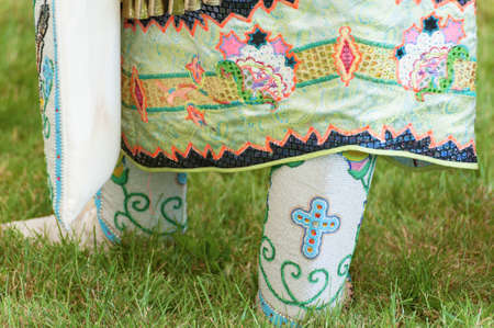 Portland, Oregon USA - June 14, 2014: Closeup of a female Native American moccasins and lower skirt at the annual Delta Park Pow Wow in Portland, Oregonのeditorial素材