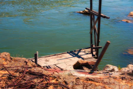 Indian fishing platforms line the shores of the Columbia River in The Dalles, Oregonの写真素材