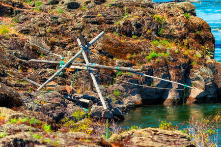Indian fishing platforms line the shores of the Columbia River in The Dalles, Oregonの写真素材