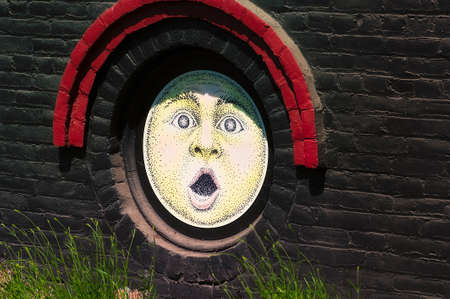 The Dalles, Oregon USA - May 11, 2014: Close up of sunshine faces on the side of the Sunshine Mill Winery Building which use to be a grainery, in The Dalles Oregon,のeditorial素材