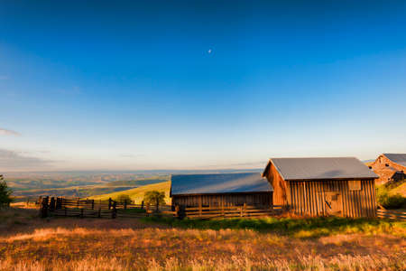 Dawns Light view of out buildings and vast landscape of The Dallas Mountain Ranch, a popular hiking and picture taking place that is part of the Columbia Hills Natural Preserve and State park in the state of Washington in the Columbia River Gorge.の写真素材