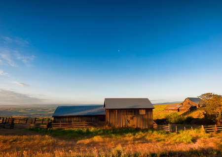 Dawn's Light view of out buildings and vast landscape of The Dallas Mountain Ranch, a popular hiking and picture taking place that is part of the Columbia Hills Natural Preserve and State park in the state of Washington in the Columbia River Gorge.の写真素材
