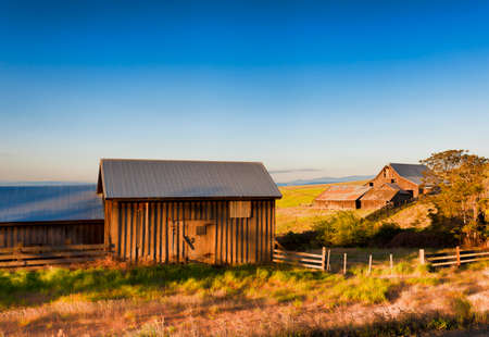 Dawn's Light view of out buildings and vast landscape of The Dallas Mountain Ranch, a popular hiking and picture taking place that is part of the Columbia Hills Natural Preserve and State park in the state of Washington in the Columbia River Gorge.の写真素材
