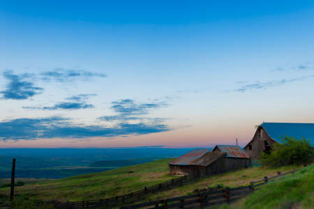 Blue Hour view of out buildings and vast landscape of The Dallas Mountain Ranch, a popular hiking and picture taking place that is part of the Columbia Hills Natural Preserve and State park in the state of Washington in the Columbia River Gorge.の写真素材