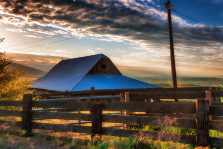 Dawns Light view of out buildings and vast landscape of The Dallas Mountain Ranchの写真素材