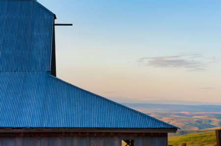 Dawn's Light view of out buildings and vast landscape of The Dallas Mountain Ranch, a popular hiking and picture taking place that is part of the Columbia Hills Natural Preserve and State park in the state of Washington in the Columbia River Gorge.の写真素材