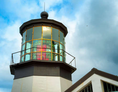 Cape Meares Lighthouse on the Oregon Coast under cloudy skiesの写真素材