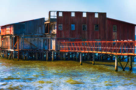 A closeup of an old  old decaying red net loft along Astoria Oregon's waterfront on the Columbia River.の写真素材