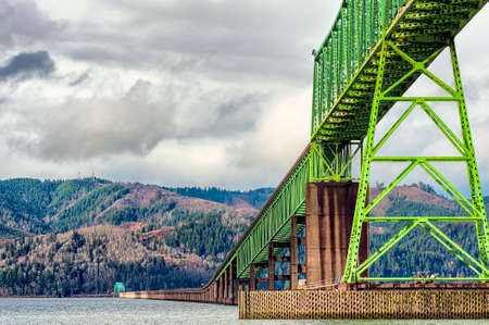 Rain clouds at Megler Bridge in Astoria, Oregon.  The bridge spans the four mile width of the Columbia River, connecting Oregon and Washington States on the coastal highway 101.  The bridge first opened to traffic on July 29, 1966.のeditorial素材