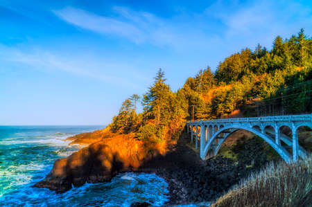 Oregon's Master Bridge Builder, Conde B. McCullough, engineer the design of the Rocky Creek Bridge.  It was dedicated to Ben Jones, father of Oregon's Coastal Highway, during opening ceremonies on September 17, 1927.の写真素材