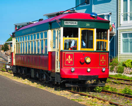 Astoria, Oregon, USA - May 30, 2014: Astoria's waterfront trolly gleems in the late afternoon sunshine as it travels along it's tracks.のeditorial素材