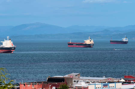 Astoria, Oregon,USA - September 13, 2015:  Three freighters lay anchored on the Columbia River in Astoria, Oregon under stormy skiesのeditorial素材